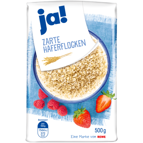 A photo of a bag of oats. The bag says 'ja!' in bold, blue letters in the top left corner. Underneath it says, 'Zarte Haferflocken.' On the cover of the bag is also a bowl of oats and some strawberries.